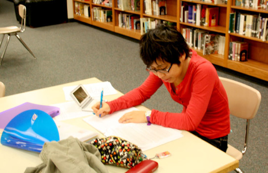 Senior Mari Uema does homework in the media center.