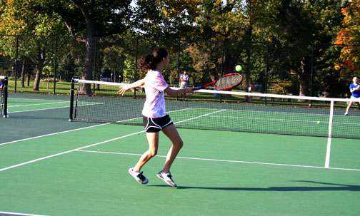 A JV player takes a swing during a match against Wayzata.