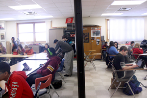 Ninth grade Open students work on different projects about Timbuktu in their World History and English classes. To promote cooperation between the different teachers and students in related projects, the divider between the two classes is opened. Photo: Ruby Dennis
