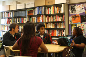 Seniors Angeles Valdez and Wyatt Peterson and juniors Samatar Ali abd Taylor Givens participate in a small group discussion.