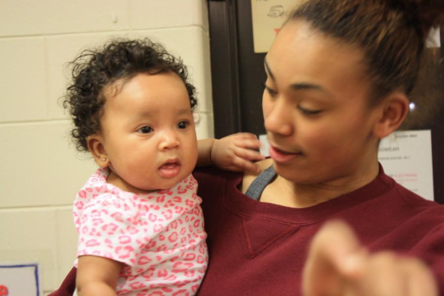 Senior Mariah Marshall holds her five month old daughter Jordyn. Marshall switched to South from Washburn this year specifically for the TAPP program. Marshall explained her choice, I visited all the ones closest to where I am and South is the one I felt most comfortable with, she said. Now Marshall is able to visit her daughter at any point in the day. According to TAPP teacher Tanya Lovelace, most mothers have lunch with their babies every day.