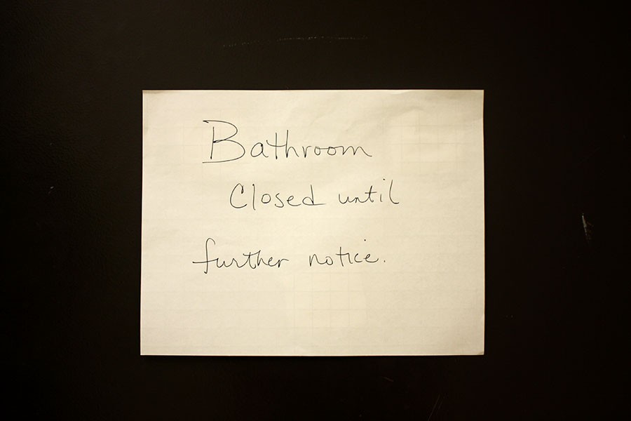 Sign outside of second floor bathroom.