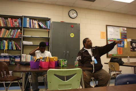 Senior Malik Overton and Special Education Assistant Londel French during the B.L.A.C.K. class. French often visits the class as a mentor. "[The course] gives [students] a place to come and talk and be themselves ... We've been there," French said.