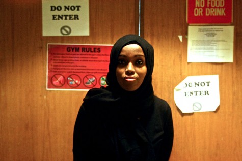 Fatimah Hussein stands outside the gym in the Brian Coyle center during all-girl gym time. Hussein and her youth basketball team the Lady Warriors designed a line of basketball uniforms that allow mobility without sacrificing modesty. 