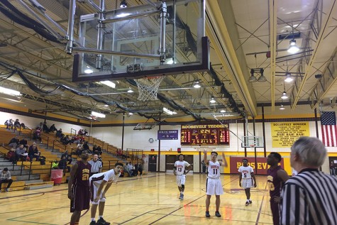 Captain Johnny Turner nails a free throw, breaking the tie. The Tigers led most of the game but narrowly lost in the last ten minutes. 