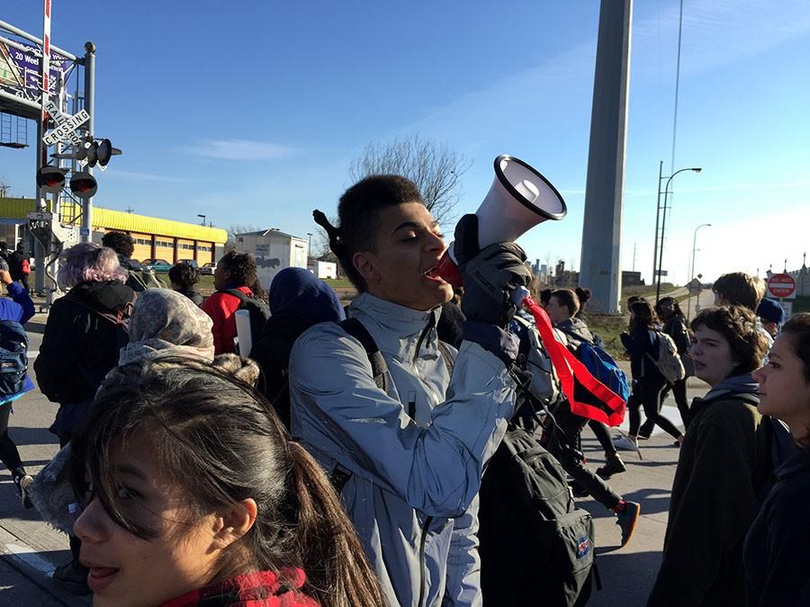 Senior Isak Douah leads a chant at a South walkout for Justice for Jamar. Douah is known for his work in social justice in the Minneapolis area. 