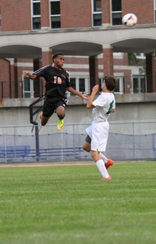  Hamzard Abdul performs a stunning header in a men’s soccer game. Abdul was selected to play in the Minnesota all-state team. 