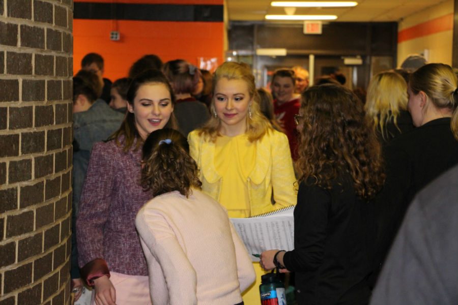 Pictured above cast and crew members rush out to hug friends, and family after the Friday night performance of ‘How to succeed in business without really trying.’ Due to concerns with the original plays misogyny, all roles were gender swapped for the South High performances.
Photo: Izzy Willette