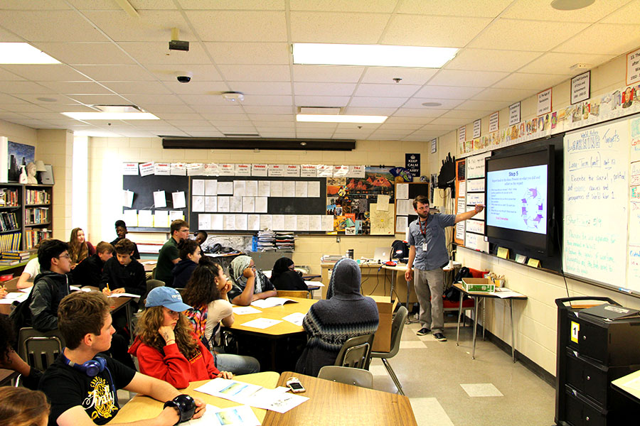 Social studies teacher Elliot Hanson, teaching Humanities I at South. Next year Hanson will be teaching in Thailand as a part of a two year program that sends teachers overseas.  Hanson is excited for the new experience, “All the new experience I think will add to my teaching ability and overall skillset of teaching in a different culture and adapting to them instead of students having to adapt to me. I think [the experience] will be unique,” he said.
