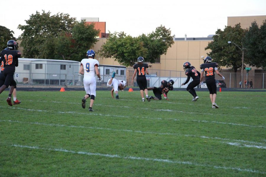 Elycia Willis, number 14 pictured above, is the second female varsity player in South history. She plays safety for the team and is fighting the misconception that only males can play football. “It actually feels pretty cool because bringing it to light that some girls that wanna play football. Showing them that they can, it’s pretty cool,” said Willis. 
Photo: Spencer Kimball