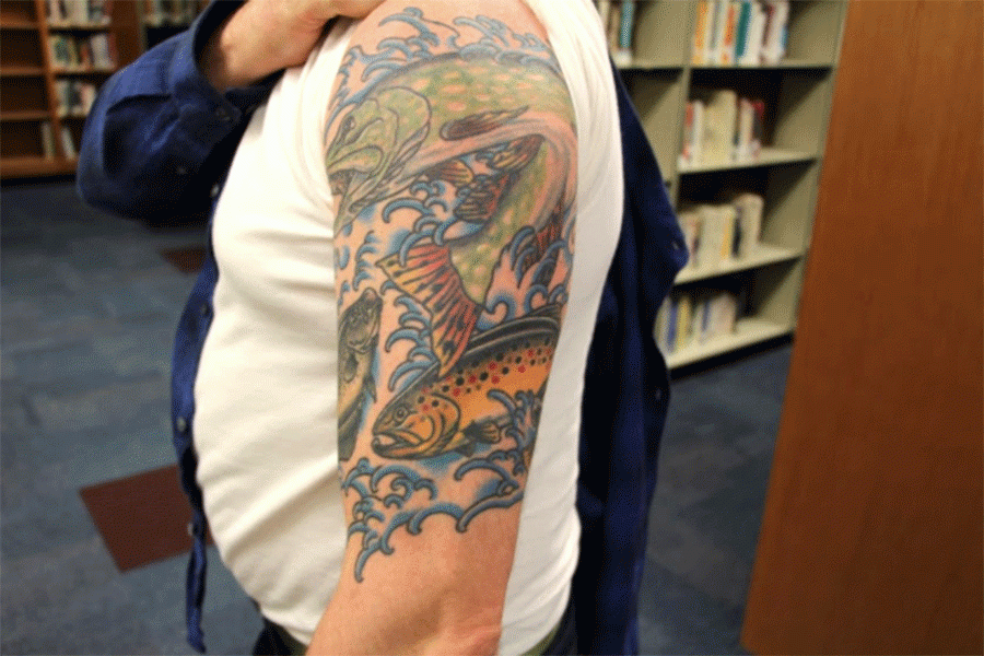 Above is Josh Fishers Fish tattoo which is a memorial of his late father, he also has a pheasant feather on his arm to honor him. Fisher and his father spent “most of the time we spent together ,especially in my adult life, was fishing,” said Fisher. 
