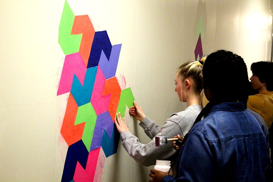 Ms. Woldum’s Open geometry class creates interdisciplinary projects every unit to match its focus on art. For their most recent unit, students are creating a mural on the wall outside Room 230. “You kind of get to put your own creativity into the stuff you’re doing, whereas in other math classes you kind of just take notes, and listen and do tests,” said Noa Simon-Latz, a freshman in Woldum’s class. 