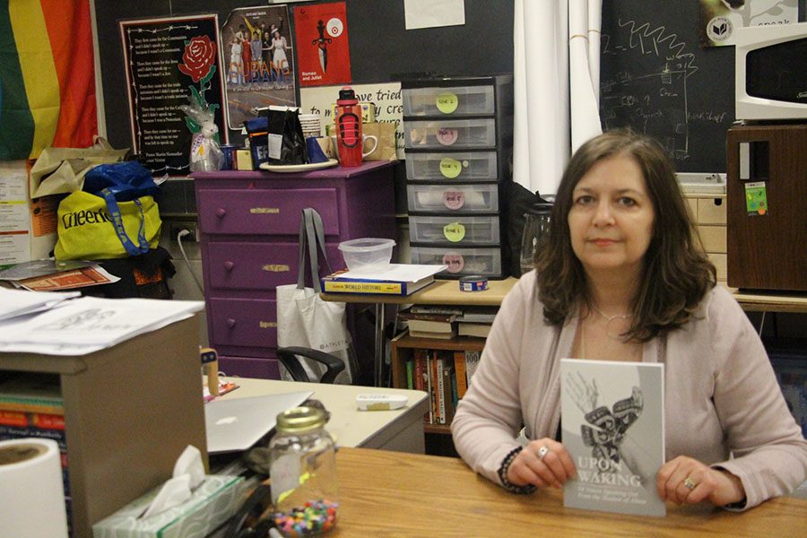 South social studies teacher Ms. Lanik shown with a copy of her book. “We can create a new normal - a new society where people who abuse are held accountable for their actions”, says Ms. Lanik. 
