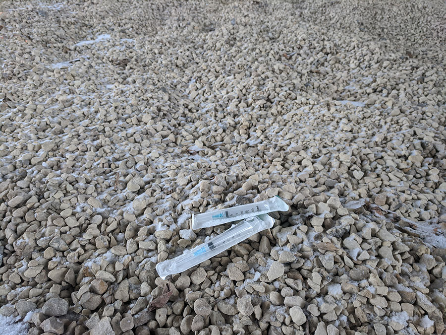 On the side of The Greenway’s path under the Cedar Avenue bridge and two hypodermic needles. While these are still inclosed in their sterile packaging and removed from the trail, many bikers have had bad interactions with used or open needles lying on the path. “[The City] actually put up a box to put the needles in, but it’s not getting used. I popped my front and rear tires on needles,”  said junior Ryder Nye.
