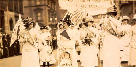 May 4th, 1912, New York City suffragist parade. Racial tension is apparent in the gaze shared between two pictured suffragettes.