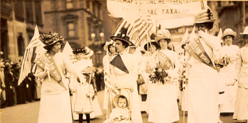 May+4th%2C+1912%2C+New+York+City+suffragist+parade.+Racial+tension+is+apparent+in+the+gaze+shared+between+two+pictured+suffragettes.