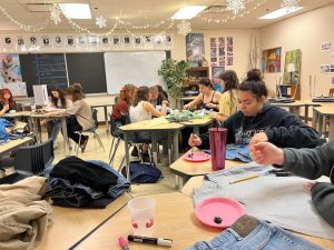 Fashion club members customizing their pieces of clothing. After being revitalized this year, the club has seen high attendance and interest.  